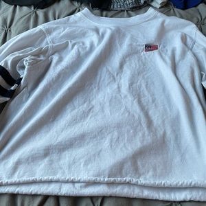 A White crop with with a little flag and stripes.